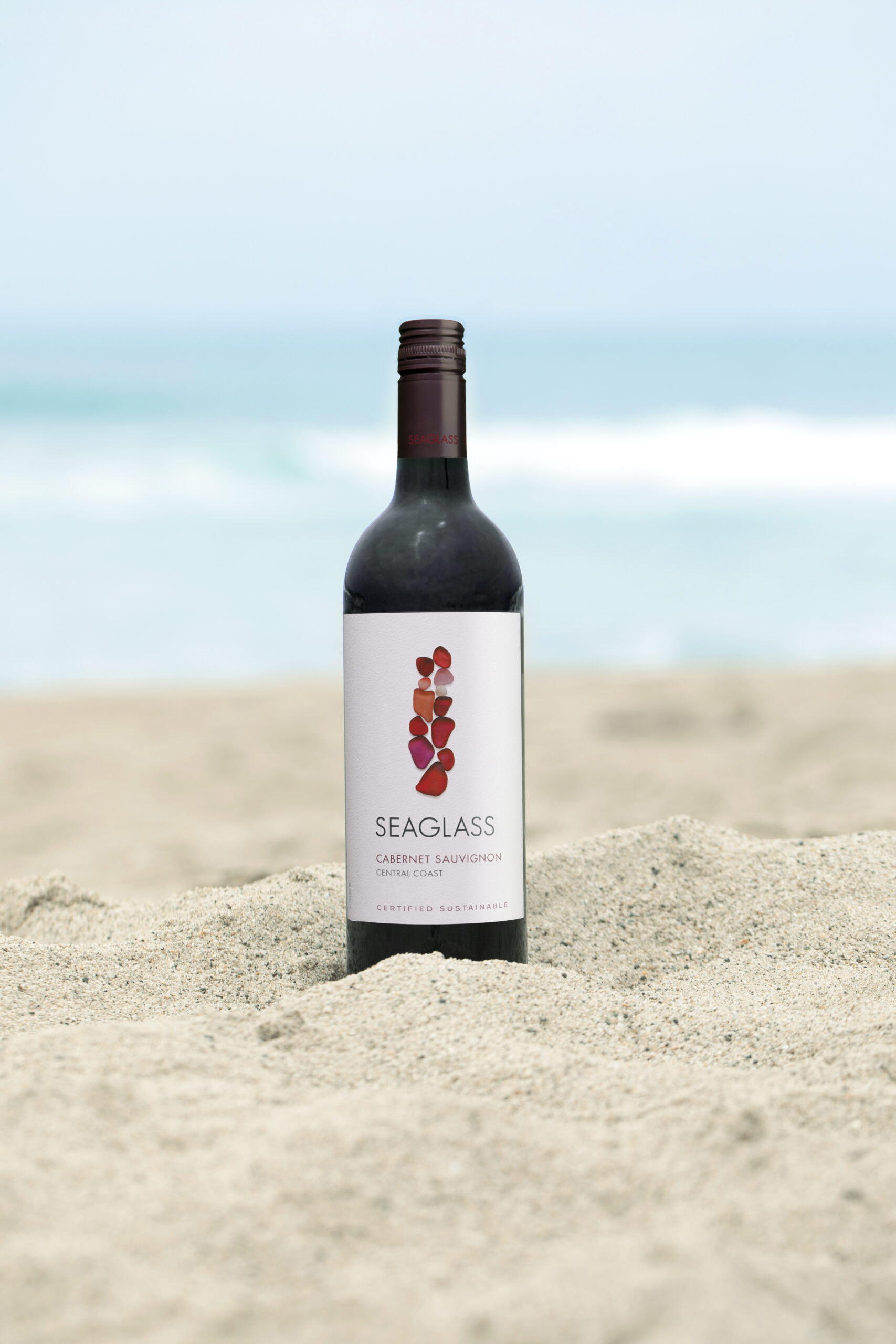 SEAGLASS Cabernet Sauvignon bottle in sand