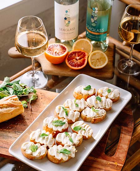 A tray of Citrus Whipped Goat Cheese Crostini's